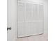 Hallway with white bifold closet doors, tile floors, and white walls at 1166 Booth Sw Rd # 301, Marietta, GA 30008