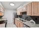 Well-lit kitchen features stainless steel appliances, granite countertops, and light wood cabinetry at 1166 Booth Sw Rd # 301, Marietta, GA 30008