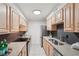 Well-lit kitchen features stainless steel appliances, granite countertops, and light wood cabinetry at 1166 Booth Sw Rd # 301, Marietta, GA 30008