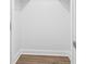 Walk-in closet with white walls, trim, and hardwood floors at 1166 Booth Sw Rd # 301, Marietta, GA 30008