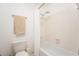 This bathroom features white tile, a shower curtain, and a white toilet at 1348 Sheffield Glen Ne Way # 8, Atlanta, GA 30329