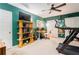 This bedroom offers green walls, a treadmill, a ceiling fan, and a display shelf at 1348 Sheffield Glen Ne Way # 8, Atlanta, GA 30329