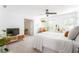 This bedroom features neutral colors, a ceiling fan, and three windows providing natural light at 1348 Sheffield Glen Ne Way # 8, Atlanta, GA 30329