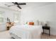 This bedroom features neutral colors, a ceiling fan, and two windows providing natural light at 1348 Sheffield Glen Ne Way # 8, Atlanta, GA 30329