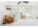 Bright and airy bedroom with neutral decor, chair, indoor plants, and large windows at 1348 Sheffield Glen Ne Way # 8, Atlanta, GA 30329