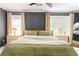 This bedroom features neutral colors, windows, and curtains providing ample natural light and a ceiling fan at 1348 Sheffield Glen Ne Way # 8, Atlanta, GA 30329