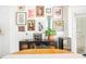 Eclectic dining room featuring gallery wall, modern furniture and natural light at 1348 Sheffield Glen Ne Way # 8, Atlanta, GA 30329