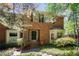 Charming two-story brick home with manicured landscaping, bay window, and inviting front entrance at 1348 Sheffield Glen Ne Way # 8, Atlanta, GA 30329