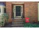 Inviting front entrance featuring brick facade, wreath, and collegiate decor at 1348 Sheffield Glen Ne Way # 8, Atlanta, GA 30329