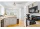Bright eat-in kitchen featuring white cabinets, granite countertops, and stainless steel appliances at 1348 Sheffield Glen Ne Way # 8, Atlanta, GA 30329