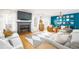 Bright living room with fireplace, hardwood floors, modern furnishings and ample natural light at 1348 Sheffield Glen Ne Way # 8, Atlanta, GA 30329