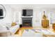 Cozy living room featuring a fireplace, TV, and comfortable seating arrangement at 1348 Sheffield Glen Ne Way # 8, Atlanta, GA 30329