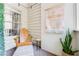 Stylish screened porch with a comfortable chair, unique artwork, and a modern boho rug at 1348 Sheffield Glen Ne Way # 8, Atlanta, GA 30329