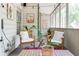 Charming screened porch with eclectic decor, cozy chairs, string lights and peaceful ambiance at 1348 Sheffield Glen Ne Way # 8, Atlanta, GA 30329