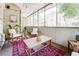 Inviting screened porch with comfortable seating, string lights, plants, and a relaxing atmosphere at 1348 Sheffield Glen Ne Way # 8, Atlanta, GA 30329