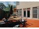 Cozy backyard featuring a wooden deck with a dining set, ideal for enjoying outdoor meals at 2459 Chestnut Lndg, Atlanta, GA 30360
