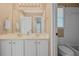Bright bathroom features a double sink vanity with white cabinets and ample lighting at 2459 Chestnut Lndg, Atlanta, GA 30360
