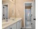 Bright bathroom features a double sink vanity with white cabinets and a shower and tub combination at 2459 Chestnut Lndg, Atlanta, GA 30360