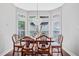 Inviting dining area with natural light, table set for six, and modern chandelier at 2459 Chestnut Lndg, Atlanta, GA 30360