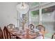 Inviting dining area with natural light, table set for six, and modern chandelier at 2459 Chestnut Lndg, Atlanta, GA 30360