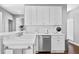 Bright kitchen with white cabinets, stainless steel appliances, and tiled backsplash at 2459 Chestnut Lndg, Atlanta, GA 30360