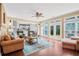 Bright living room with hardwood floors, a ceiling fan and French doors to the outdoor patio at 2459 Chestnut Lndg, Atlanta, GA 30360