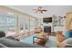 Warm living room featuring a fireplace, built-ins, hardwood floors, and access to the deck at 2459 Chestnut Lndg, Atlanta, GA 30360