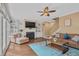 Comfortable living room with built-in shelves, fireplace, and a view to the backyard at 2459 Chestnut Lndg, Atlanta, GA 30360