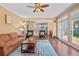 Open living room with hardwood floors, bright light, and an open access to the kitchen at 2459 Chestnut Lndg, Atlanta, GA 30360