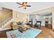 Cozy living room featuring hardwood floors, staircase access, and an inviting open layout at 2459 Chestnut Lndg, Atlanta, GA 30360