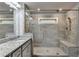 A spacious bathroom with double sinks and a shower with a seat at 4232 Perimeter E Park # 110, Atlanta, GA 30341