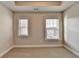 Bedroom showcasing neutral carpet, recessed lighting, and two bright windows at 4232 Perimeter E Park # 110, Atlanta, GA 30341