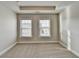 Bedroom showcasing neutral carpet, recessed lighting, and two bright windows at 4232 Perimeter E Park # 110, Atlanta, GA 30341