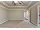 This bedroom features neutral carpet and paint with a view of a hall and ensuite bathroom at 4232 Perimeter E Park # 110, Atlanta, GA 30341