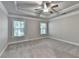 This bedroom features neutral carpet, paint, and a ceiling fan at 4232 Perimeter E Park # 110, Atlanta, GA 30341