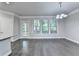 Sun-drenched dining area with hardwood floors, large windows, and access to the back patio at 4232 Perimeter E Park # 110, Atlanta, GA 30341