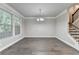 Bright dining room features hardwood floors, large windows, and modern lighting at 4232 Perimeter E Park # 110, Atlanta, GA 30341