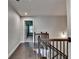 Upstairs hallway featuring dark wood floors and ornate wood and metal banister at 4232 Perimeter E Park # 110, Atlanta, GA 30341