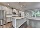 Modern kitchen featuring gray cabinets, stainless appliances, granite counters, and hardwood floors at 4232 Perimeter E Park # 110, Atlanta, GA 30341