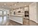Spacious kitchen with a granite island, stainless appliances, and gray cabinets at 4232 Perimeter E Park # 110, Atlanta, GA 30341