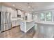 Bright, open kitchen with gray cabinets, stainless appliances, granite countertops, and hardwood floors at 4232 Perimeter E Park # 110, Atlanta, GA 30341