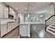 Gray kitchen features modern appliances, granite countertops, hardwood floors, and an open layout at 4232 Perimeter E Park # 110, Atlanta, GA 30341