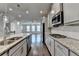 Spacious kitchen with granite island, stainless appliances, and an open view to the living space at 4232 Perimeter E Park # 110, Atlanta, GA 30341