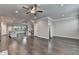 Living room features hardwood floors, ceiling fan, and entrance to bath at 4232 Perimeter E Park # 110, Atlanta, GA 30341