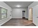 Well-lit living room featuring hardwood floors, a window, and a doorway at 4232 Perimeter E Park # 110, Atlanta, GA 30341
