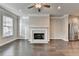 Cozy living room with a fireplace and stainless steel refrigerator at 4232 Perimeter E Park # 110, Atlanta, GA 30341