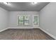 Bright living room with hardwood floors, large window and door showcasing the outdoor space at 4232 Perimeter E Park # 110, Atlanta, GA 30341