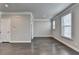 Bright living room with hardwood floors, crown molding, and natural light from two windows at 4232 Perimeter E Park # 110, Atlanta, GA 30341
