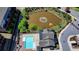 Birds-eye view of a community pool with a fountain and pond and a view of the nearby condos and parking at 4232 Perimeter E Park # 110, Atlanta, GA 30341