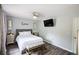 Nicely appointed bedroom with wood-look flooring, ceiling fan and mounted flat screen television at 5567 Executive Way, Norcross, GA 30071